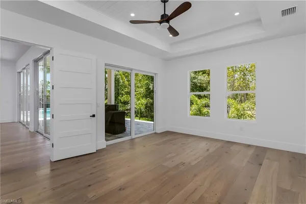 a kitchen with a sink a large window and a counter top space