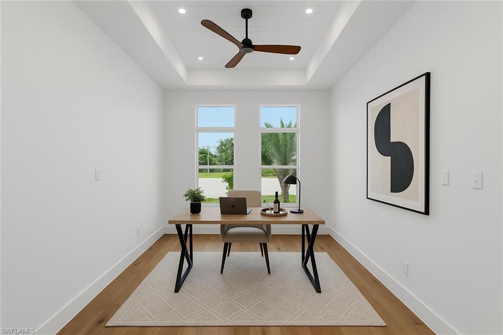2854 Coach House Way Naples, FL 34105 - Photo 7 of 45 Office space featuring a raised ceiling, light wood-style floors, a ceiling fan, and recessed lighting