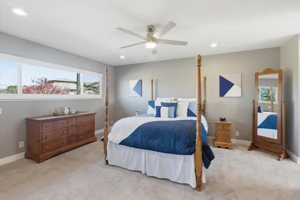 a dinning table and chairs under an umbrella