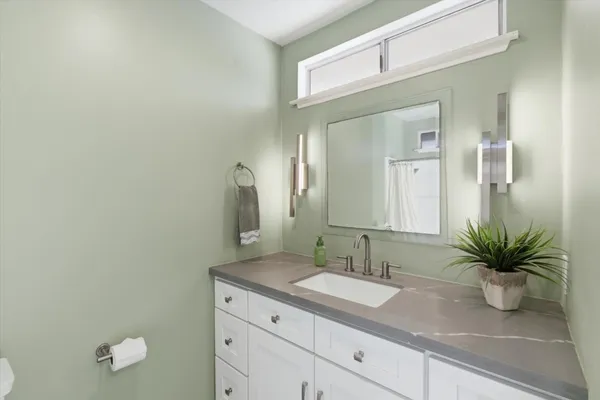 a swimming pool with outdoor seating and yard