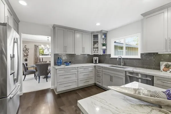 a bedroom with a bed window and couch