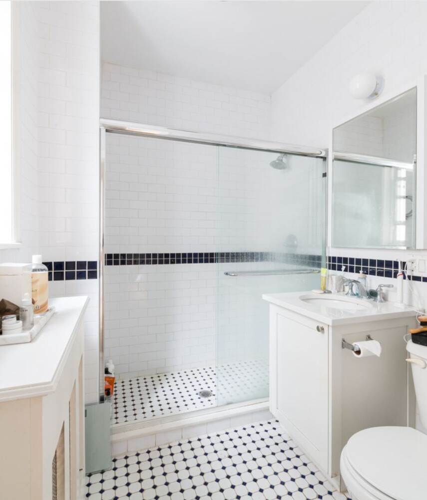 108 East 66th Street, Unit 2B Manhattan, NY 10065 - Photo 4 of 4 a bathroom with a sink toilet and shower
