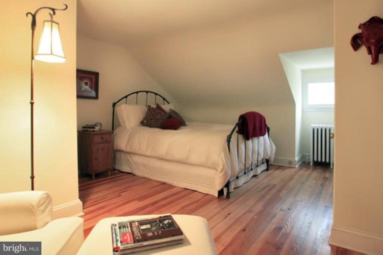 212 Dunkirk Road Baltimore, MD 21212 - Photo 17 of 30 a bedroom with a bed and a window
