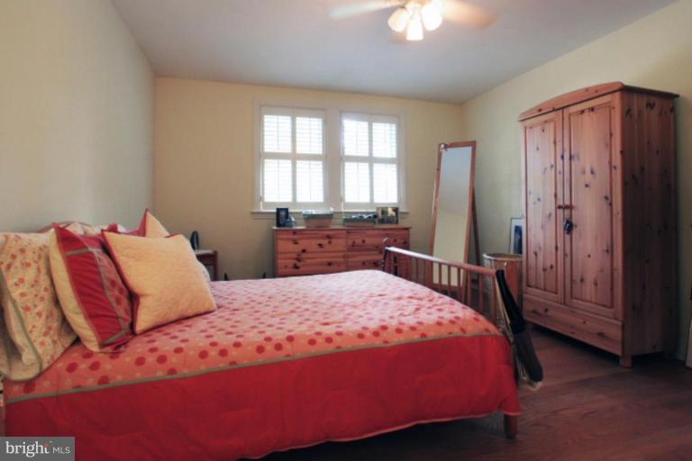 212 Dunkirk Road Baltimore, MD 21212 - Photo 22 of 30 a bedroom with a bed and a window