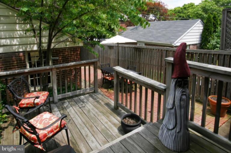 212 Dunkirk Road Baltimore, MD 21212 - Photo 4 of 30 a view of a wooden deck with furniture