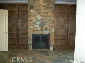 20552 Buchanan Hollow Road Le Grand, CA 95333 - Photo 12 of 26 a living room with a fireplace