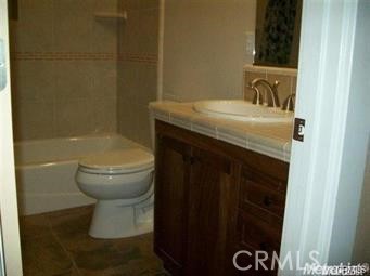 20552 Buchanan Hollow Road Le Grand, CA 95333 - Photo 16 of 26 a bathroom with a sink and a toilet