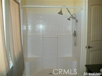 20552 Buchanan Hollow Road Le Grand, CA 95333 - Photo 20 of 26 a bathroom with a glass shower door