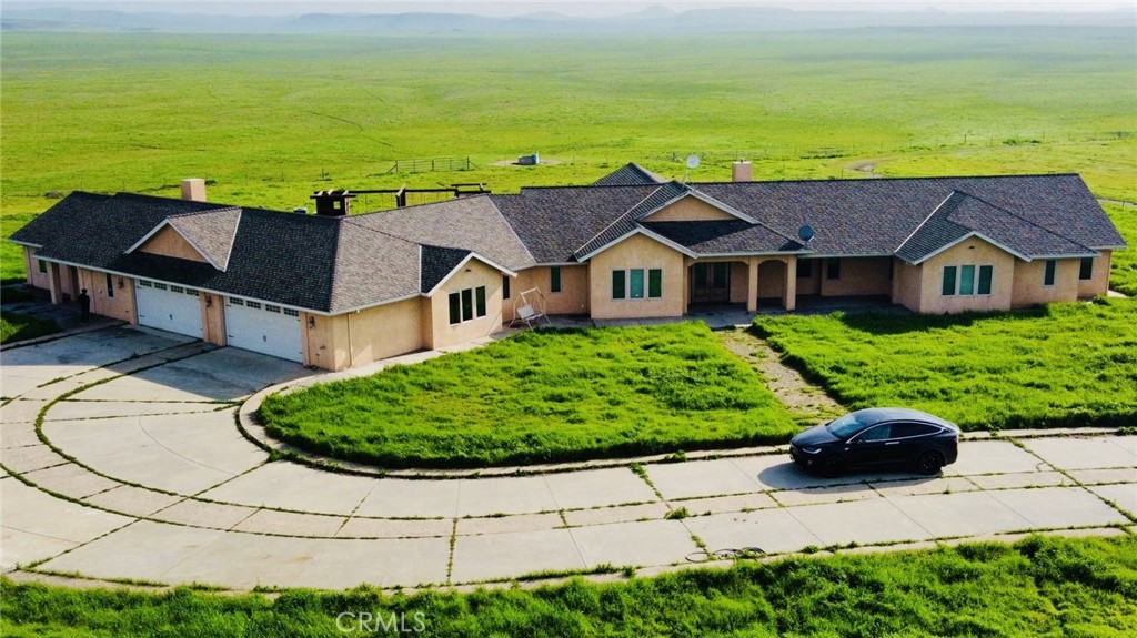 20552 Buchanan Hollow Road Le Grand, CA 95333 - Photo 2 of 26 an aerial view of a house with a garden and lake view