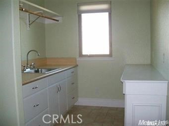 20552 Buchanan Hollow Road Le Grand, CA 95333 - Photo 22 of 26 a bathroom with a sink and a mirror