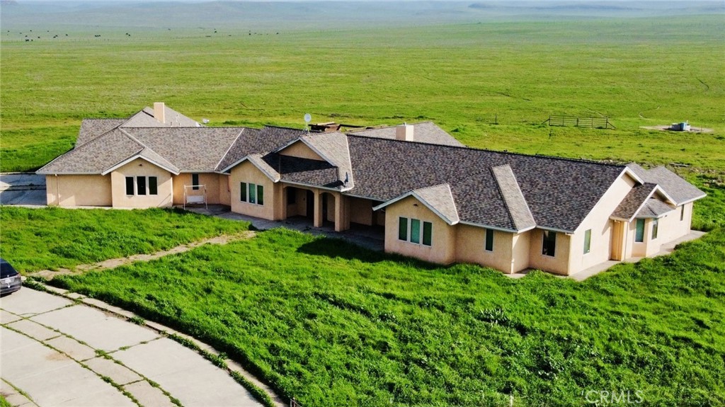 20552 Buchanan Hollow Road Le Grand, CA 95333 - Photo 3 of 26 an aerial view of a house with a garden and lake view