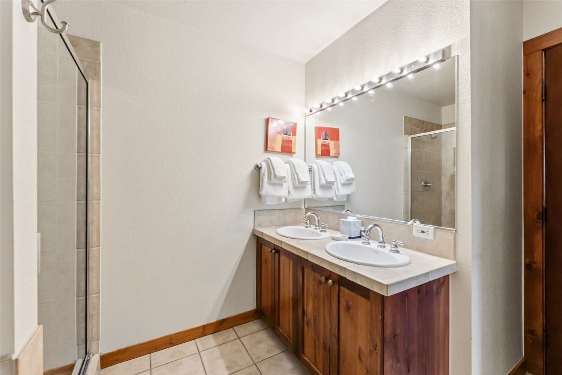 505 South Main Street, Unit 2403 Breckenridge, CO 80424 - Photo 17 of 29 a bathroom with a sink and a mirror