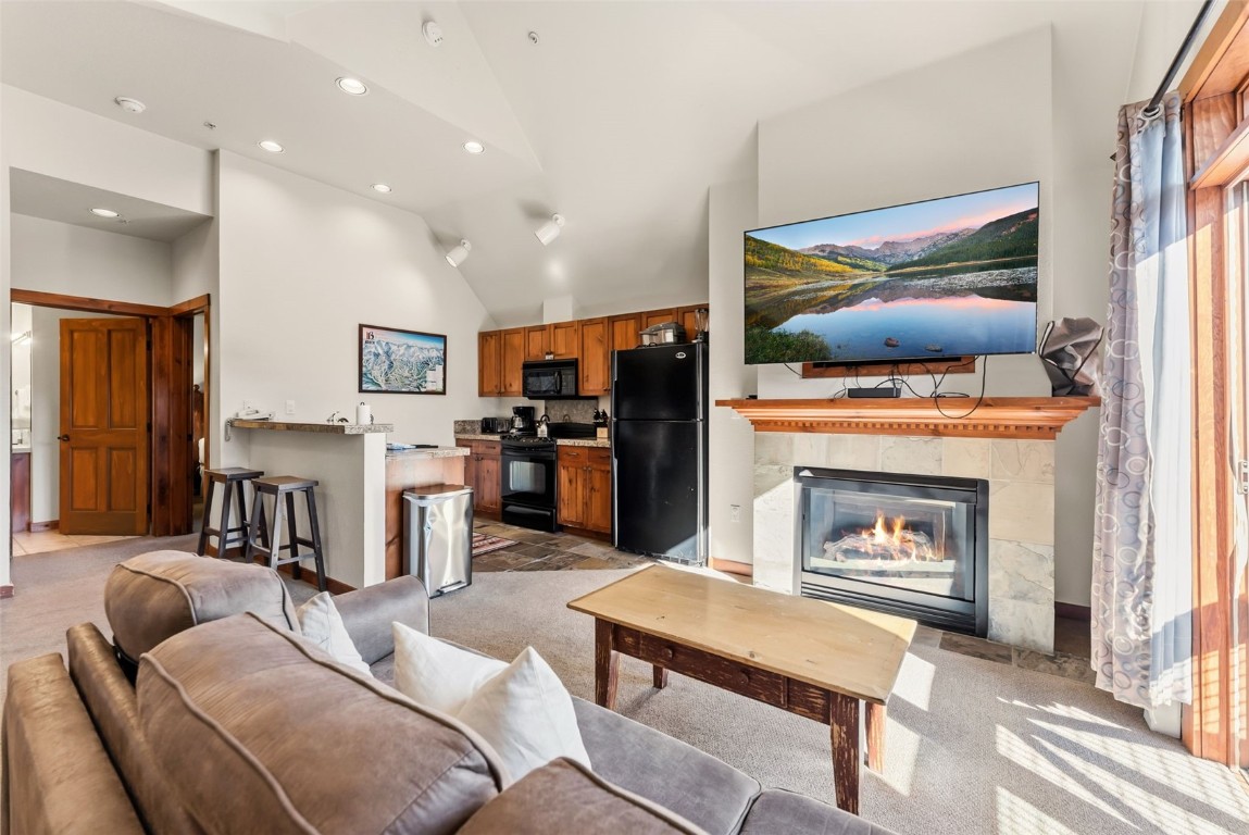 505 South Main Street, Unit 2403 Breckenridge, CO 80424 - Photo 5 of 29 a living room with furniture and a fireplace