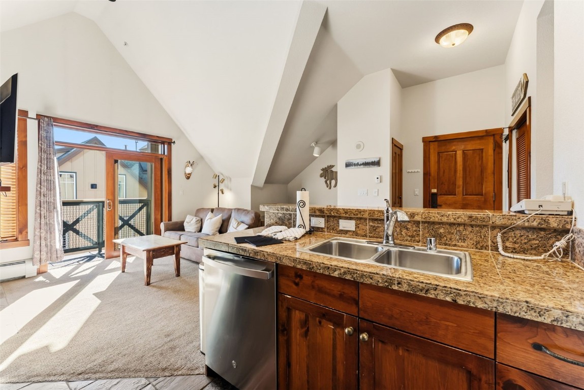 505 South Main Street, Unit 2403 Breckenridge, CO 80424 - Photo 8 of 29 a kitchen with a sink and large windows