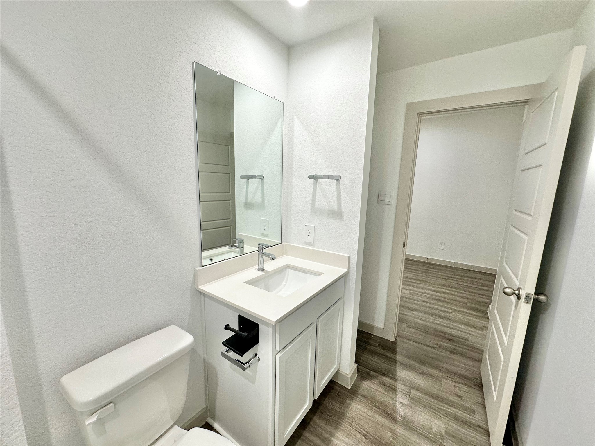 1107 Curly Angora Court Rosharon, TX 77583 - Photo 17 of 42 a bathroom with a sink a toilet and mirror