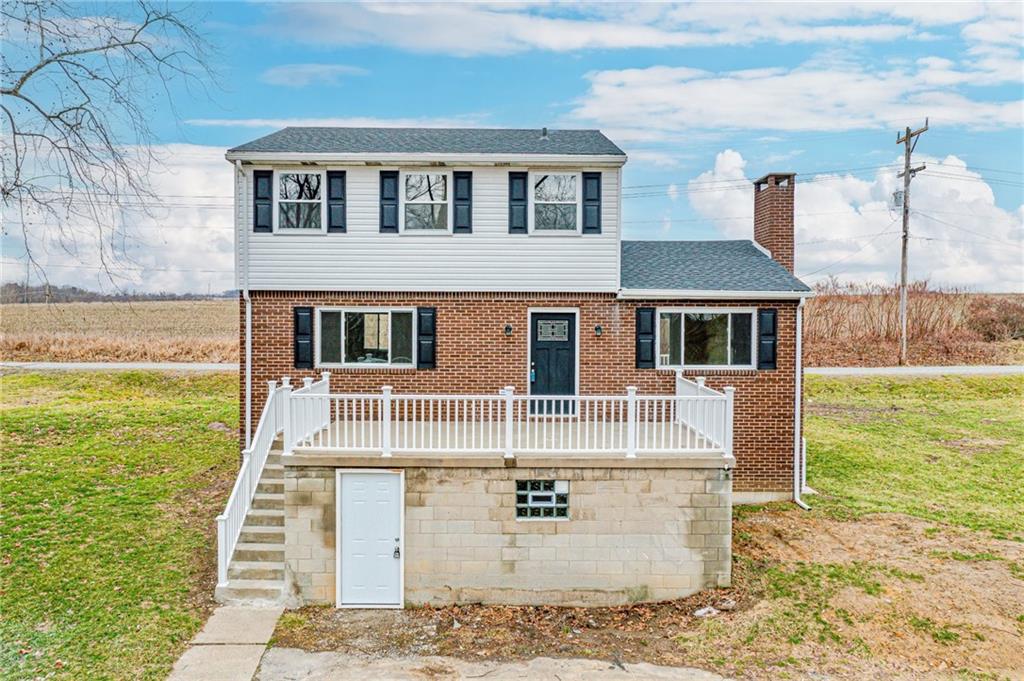 608 Fitz Henry Road Smithton, PA 15479 - Photo 1 of 40 a front view of a house with a garden