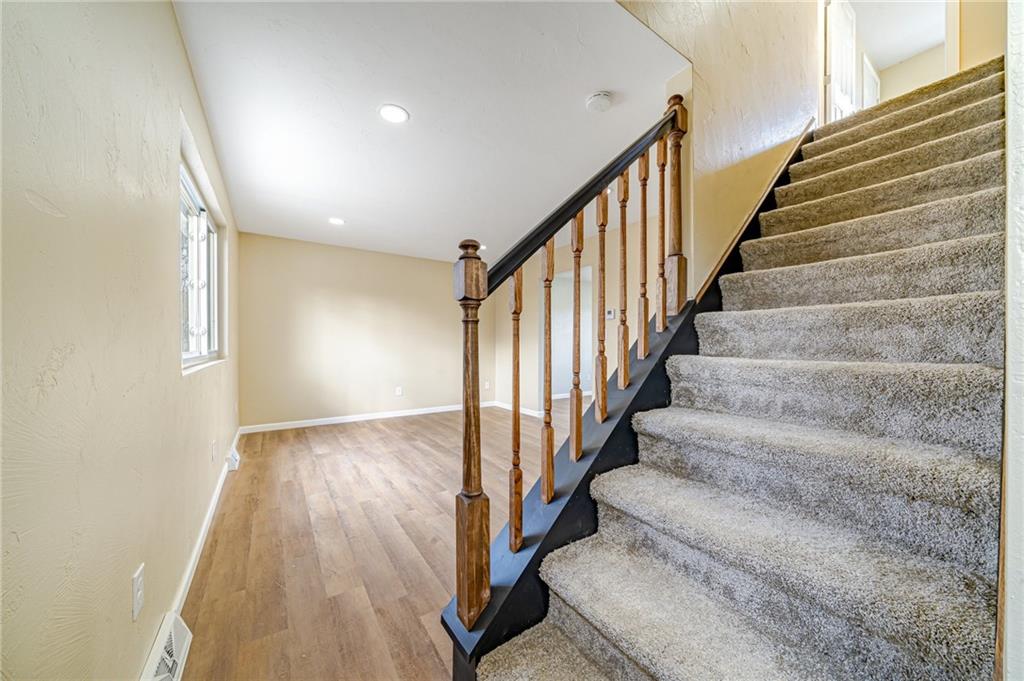 608 Fitz Henry Road Smithton, PA 15479 - Photo 11 of 40 a view of entryway with wooden floor and stairs