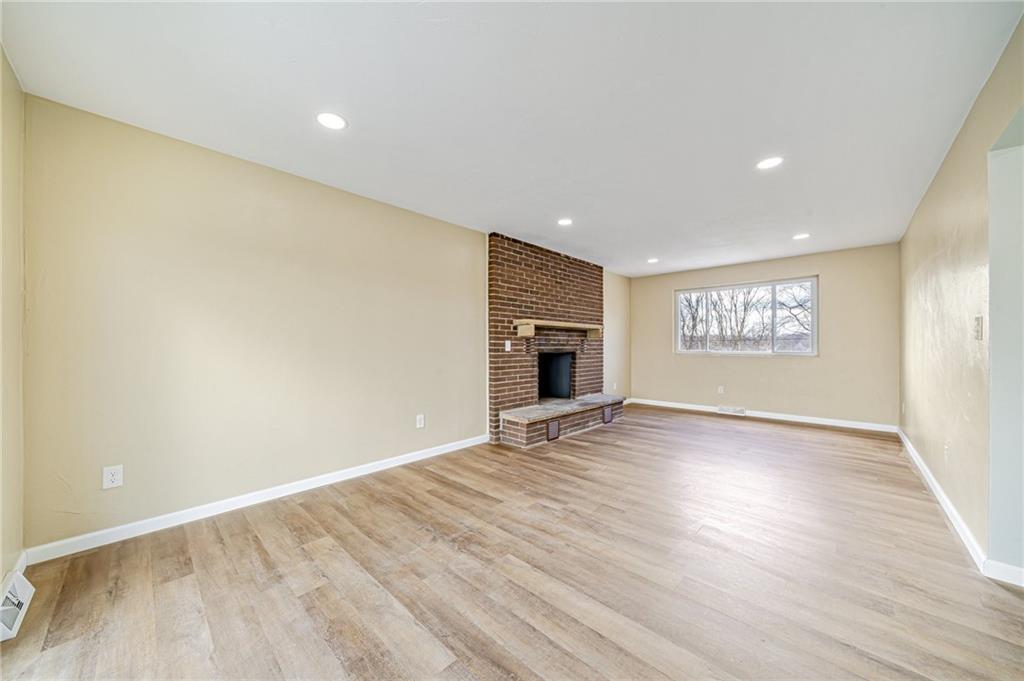 608 Fitz Henry Road Smithton, PA 15479 - Photo 15 of 40 wooden floor in an empty room with a window