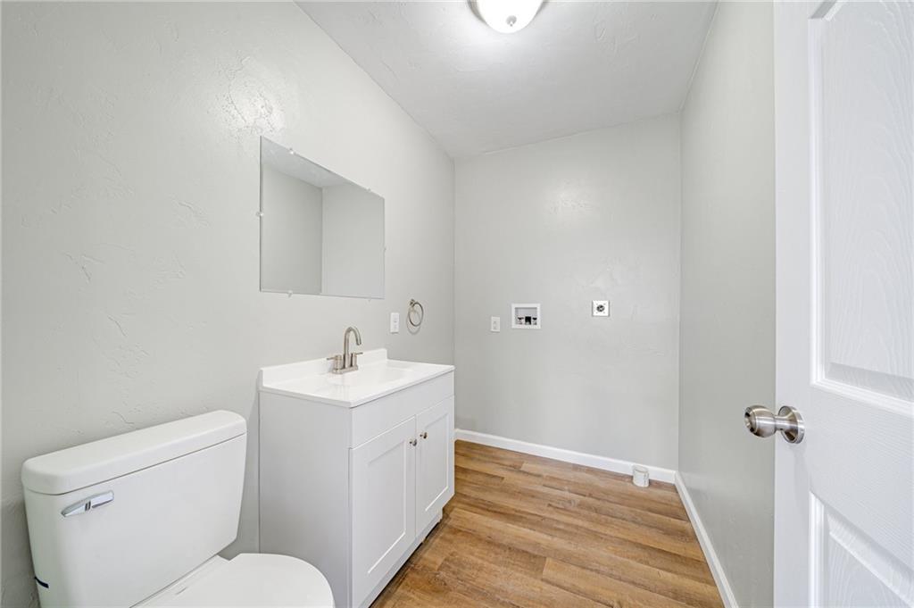 608 Fitz Henry Road Smithton, PA 15479 - Photo 18 of 40 a bathroom with a sink toilet and a mirror