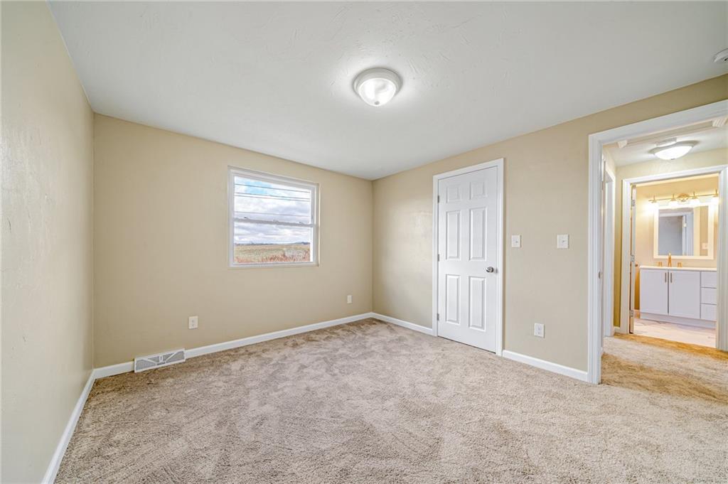 608 Fitz Henry Road Smithton, PA 15479 - Photo 19 of 40 an empty room with windows and closet