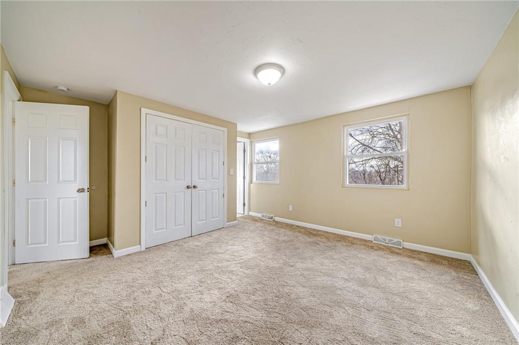 608 Fitz Henry Road Smithton, PA 15479 - Photo 20 of 40 a view of an empty room with a window