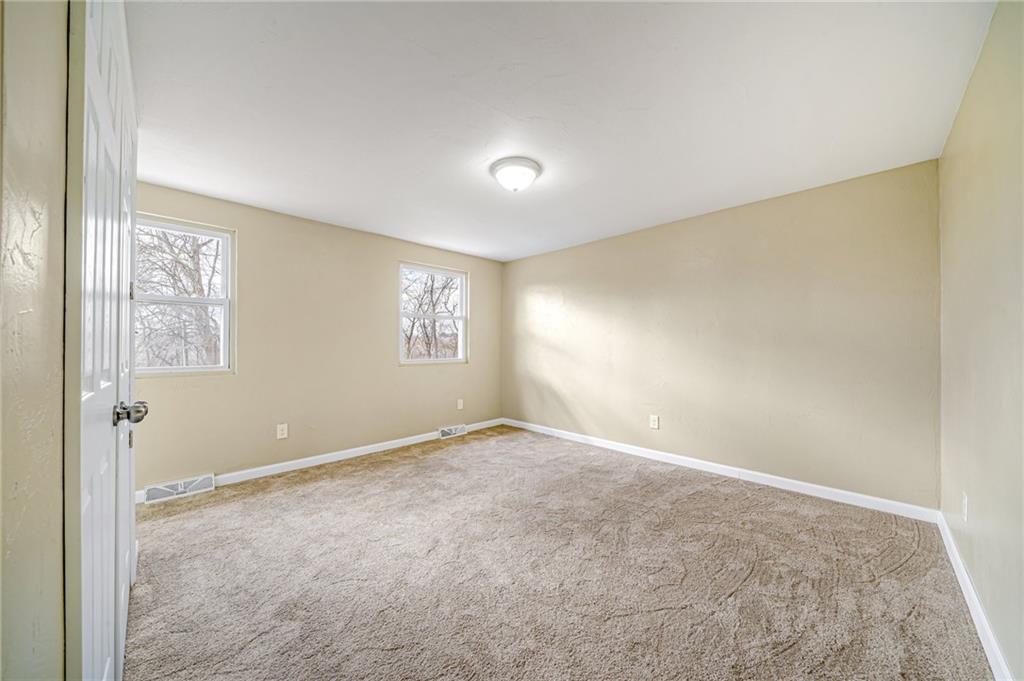 608 Fitz Henry Road Smithton, PA 15479 - Photo 21 of 40 an empty room with windows