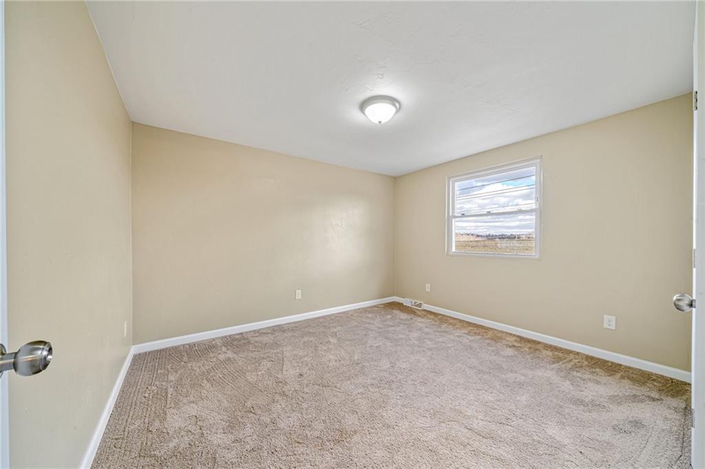 608 Fitz Henry Road Smithton, PA 15479 - Photo 25 of 40 a view of an empty room with a window