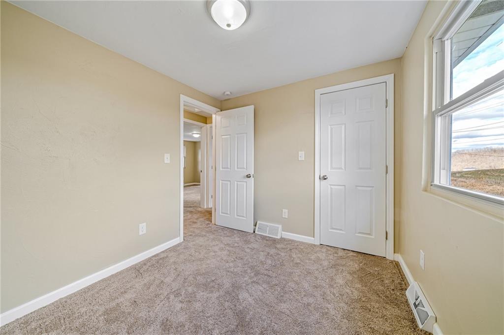 608 Fitz Henry Road Smithton, PA 15479 - Photo 26 of 40 a view of an empty room and window