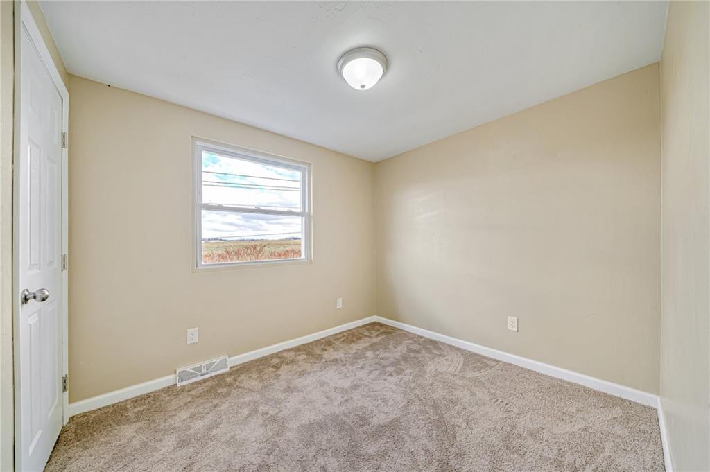 608 Fitz Henry Road Smithton, PA 15479 - Photo 27 of 40 a view of an empty room with a window