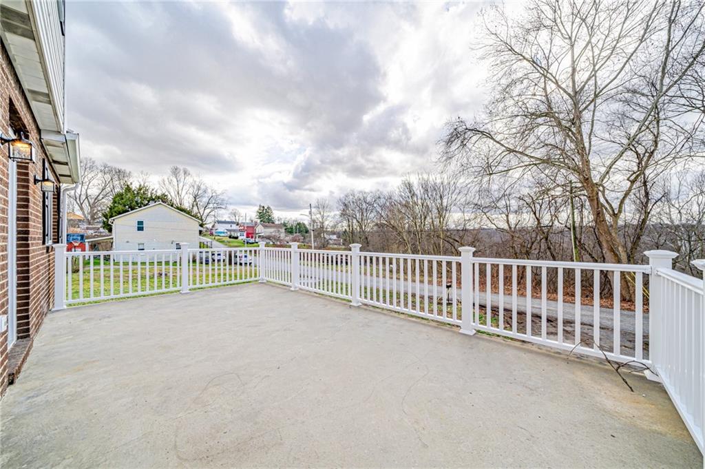 608 Fitz Henry Road Smithton, PA 15479 - Photo 34 of 40 a view of a balcony with a small yard