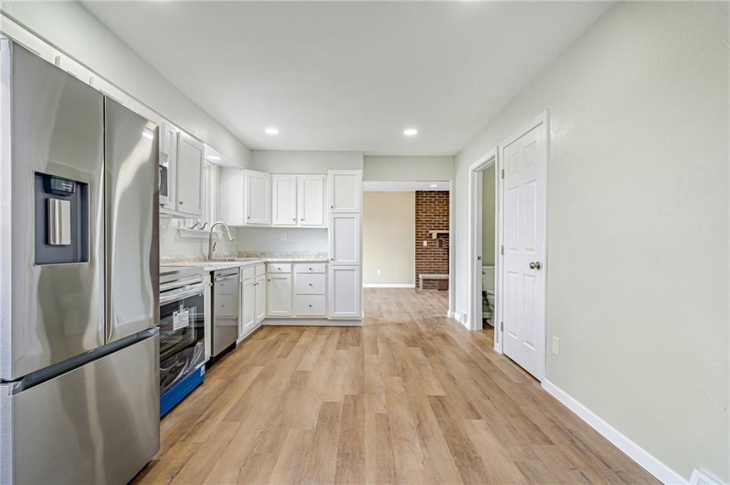 608 Fitz Henry Road Smithton, PA 15479 - Photo 4 of 40 a kitchen with a refrigerator a sink and dishwasher