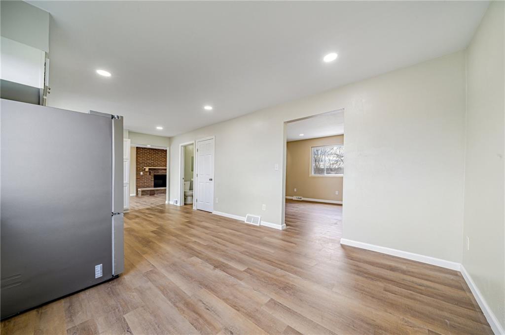 608 Fitz Henry Road Smithton, PA 15479 - Photo 10 of 40 a view of an empty room with wooden floor and closet