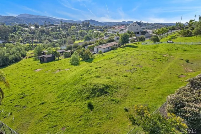 a view of a wooden door and a yard