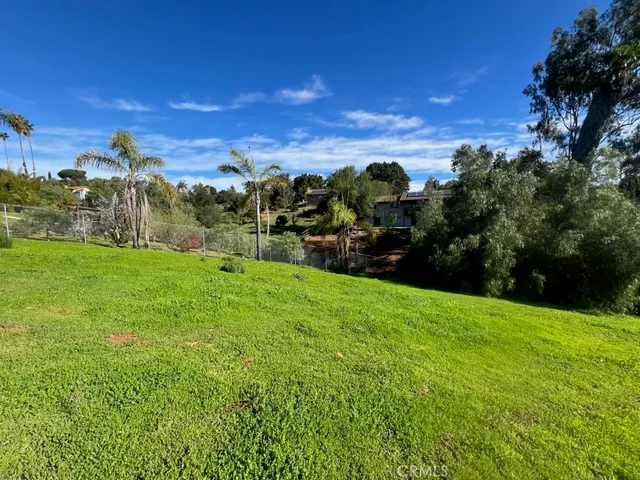 a view of a big yard with a house