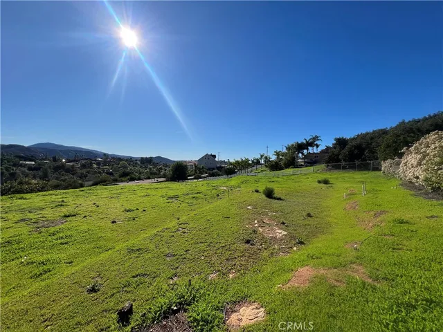 a view of a garden with a building in the background