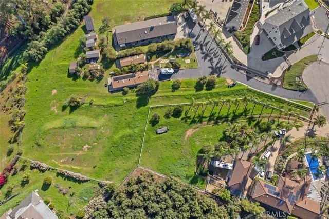 an aerial view of a residential houses with outdoor space