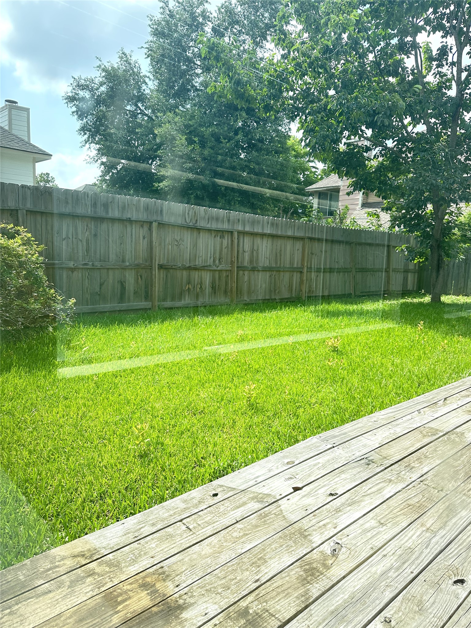 14702 Rancho Vista Drive Houston, TX 77083 - Photo 16 of 18 a view of a backyard with a garden