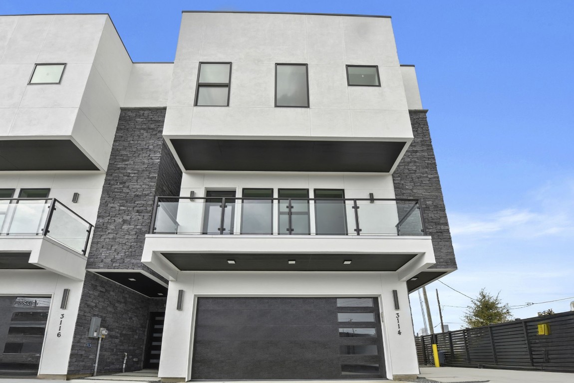 a front view of a house with a balcony