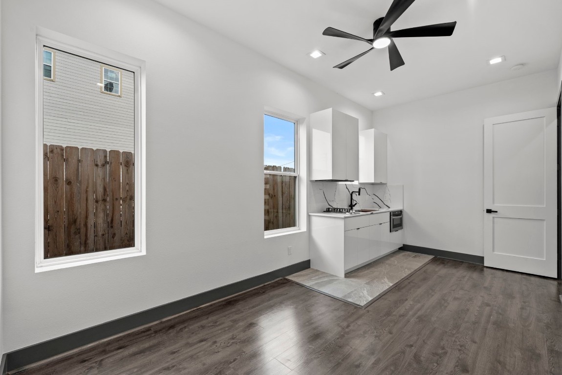3114 Clay Street Houston, TX 77003 - Photo 12 of 28 a kitchen with a refrigerator and white cabinets