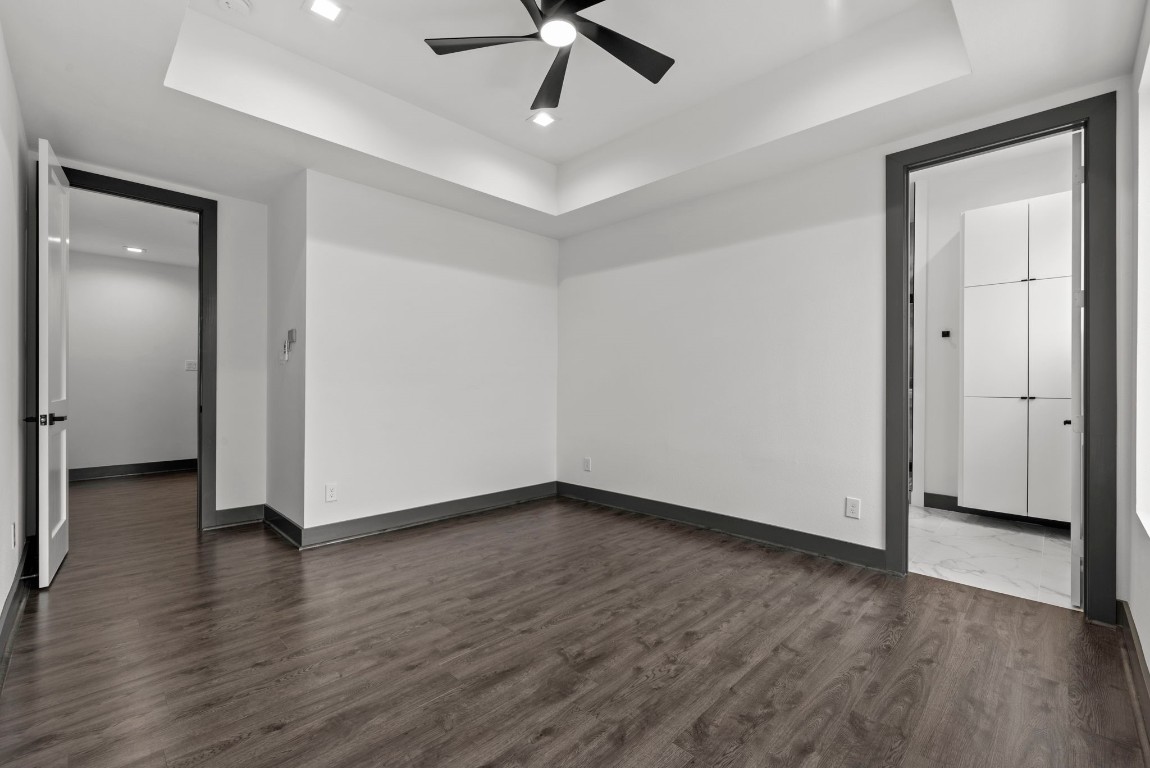 3114 Clay Street Houston, TX 77003 - Photo 14 of 28 an empty room with wooden floor and ceiling fan