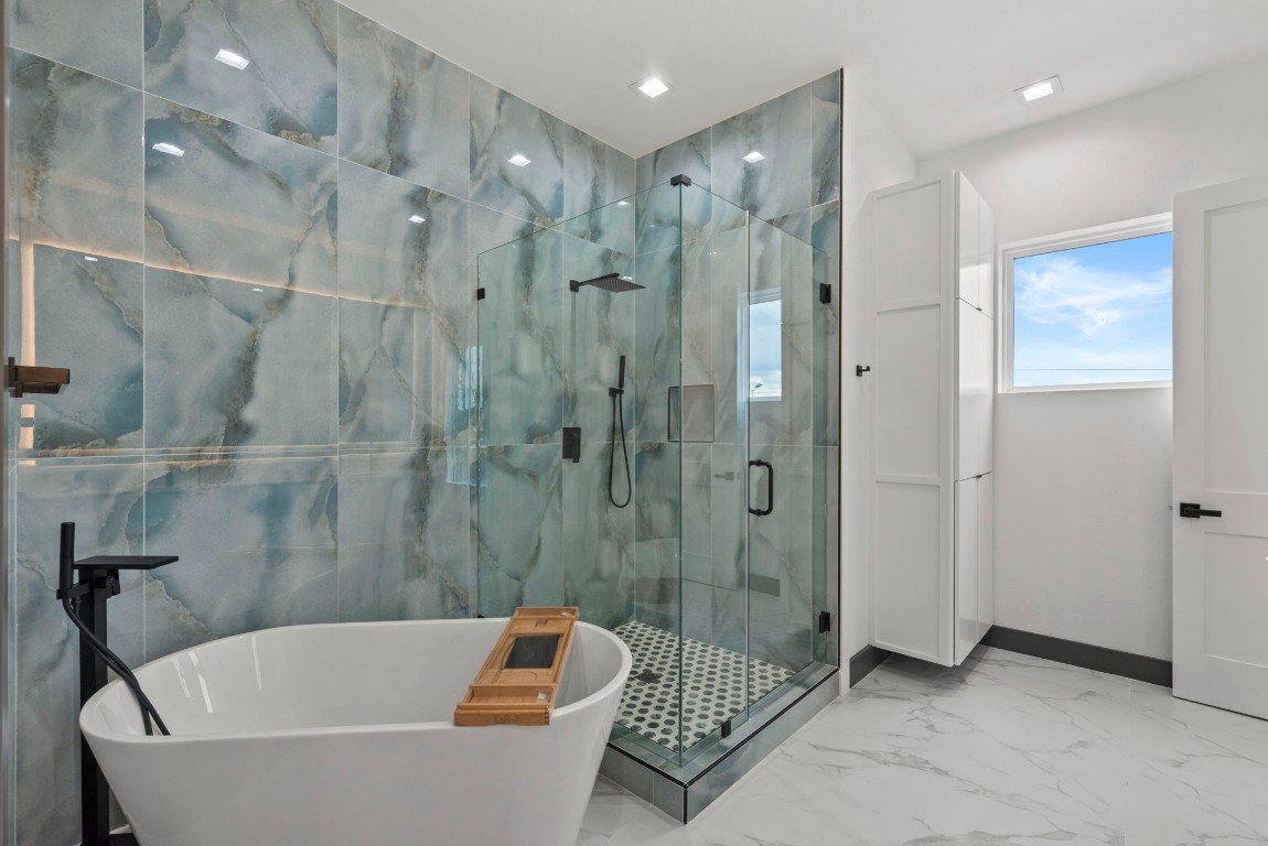 3114 Clay Street Houston, TX 77003 - Photo 16 of 28 a bathroom with a bathtub and a shower