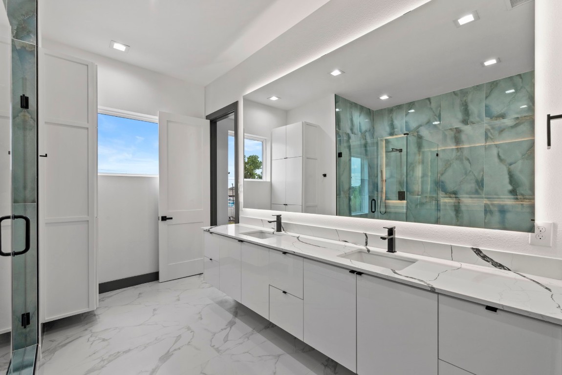 3114 Clay Street Houston, TX 77003 - Photo 17 of 28 a bathroom with double sink and a mirror