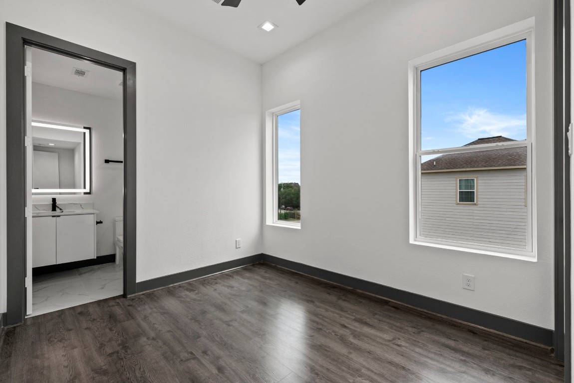 3114 Clay Street Houston, TX 77003 - Photo 19 of 28 a view of an empty room with a window and wooden floor