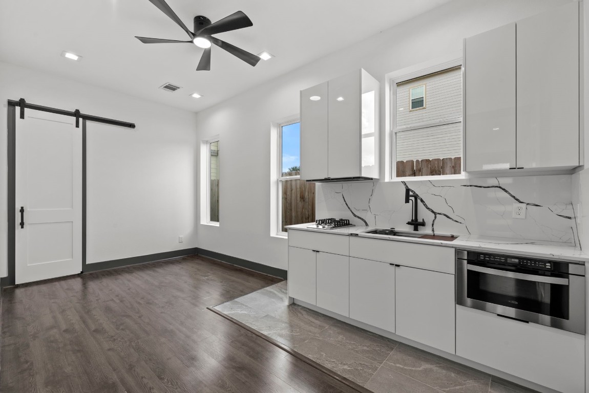 3114 Clay Street Houston, TX 77003 - Photo 8 of 28 a kitchen with stainless steel appliances a sink stove and cabinets
