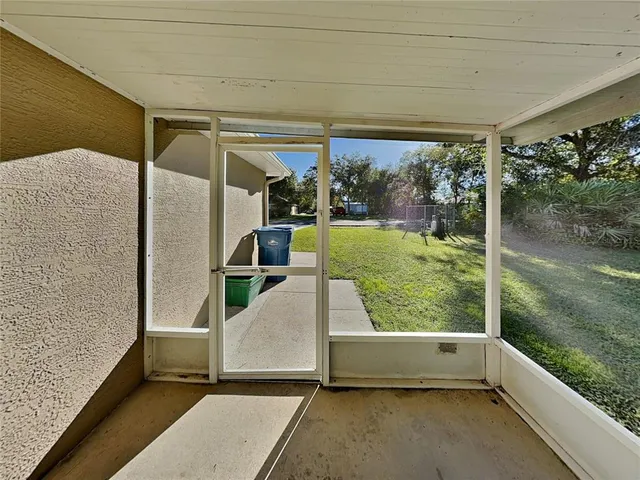 a view of a back yard from a balcony