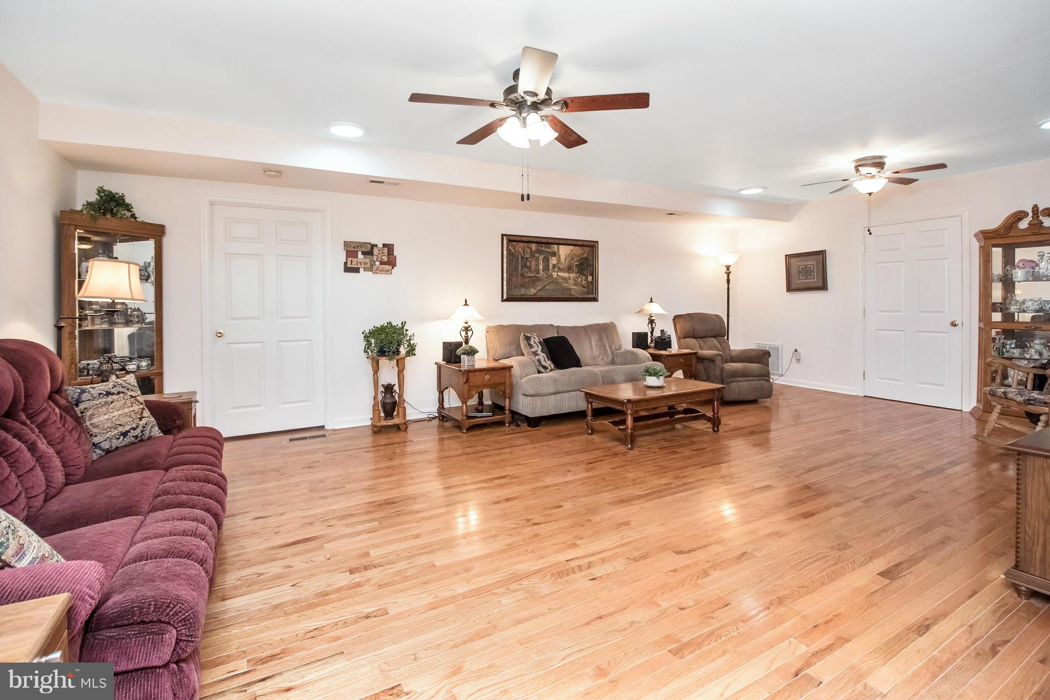 6101 Ridge Tree Road Fredericksburg, VA 22407 - Photo 12 of 30 a living room with furniture and a wooden floor