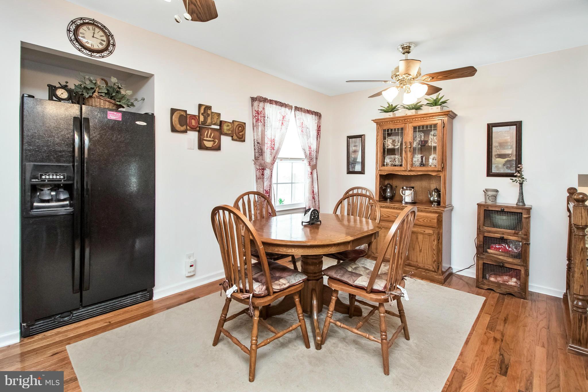 6101 Ridge Tree Road Fredericksburg, VA 22407 - Photo 15 of 30 a view of a dining room with furniture and chandelier