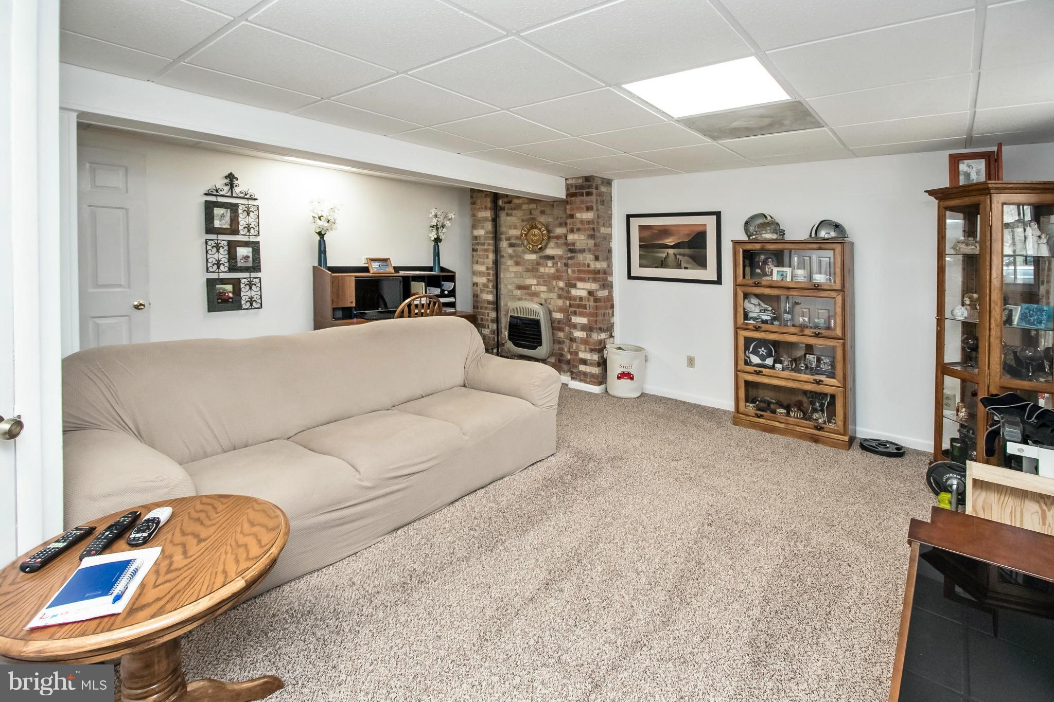 6101 Ridge Tree Road Fredericksburg, VA 22407 - Photo 23 of 30 a living room with furniture and a flat screen tv