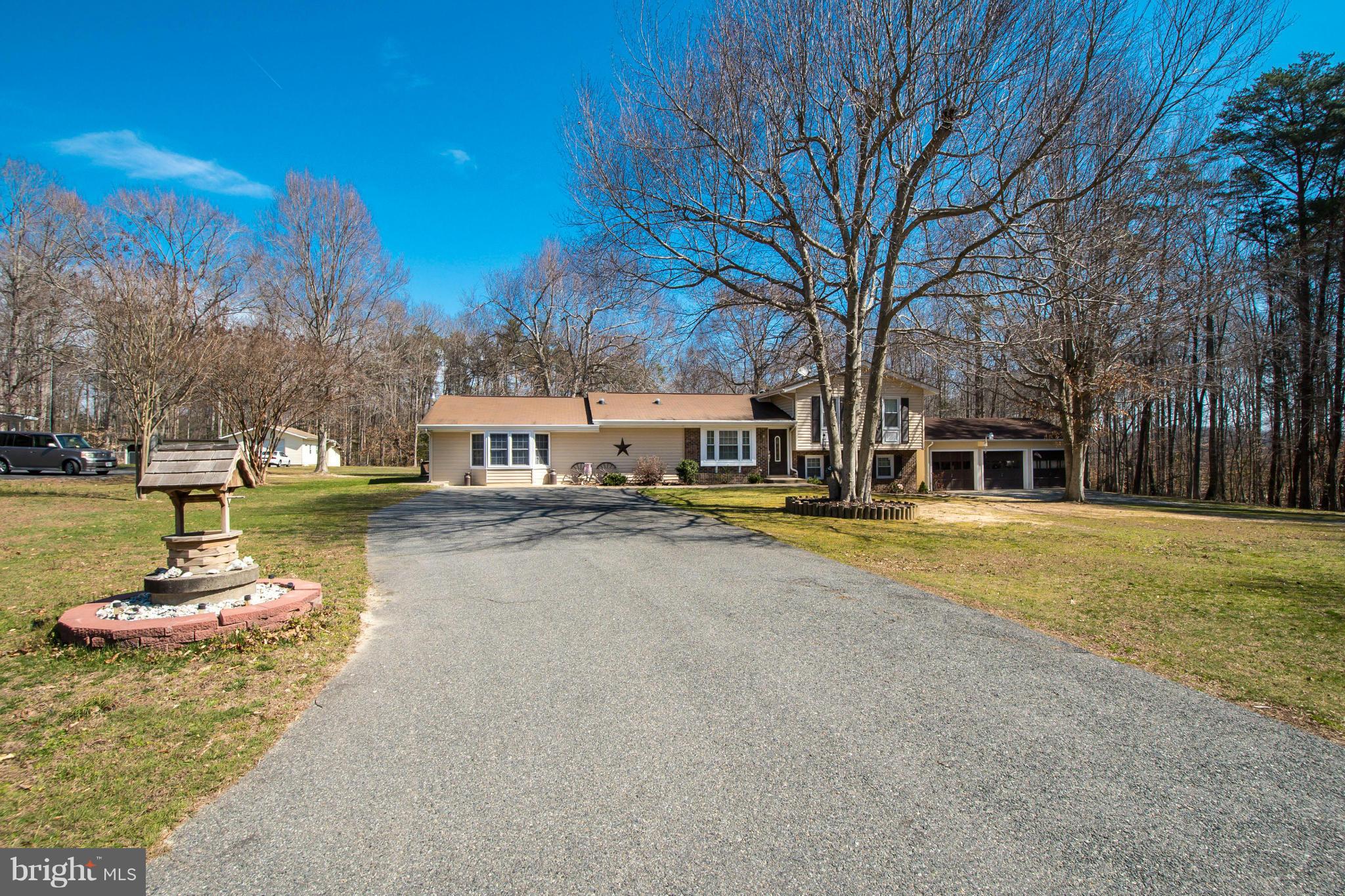 6101 Ridge Tree Road Fredericksburg, VA 22407 - Photo 3 of 30 a house with trees in the background