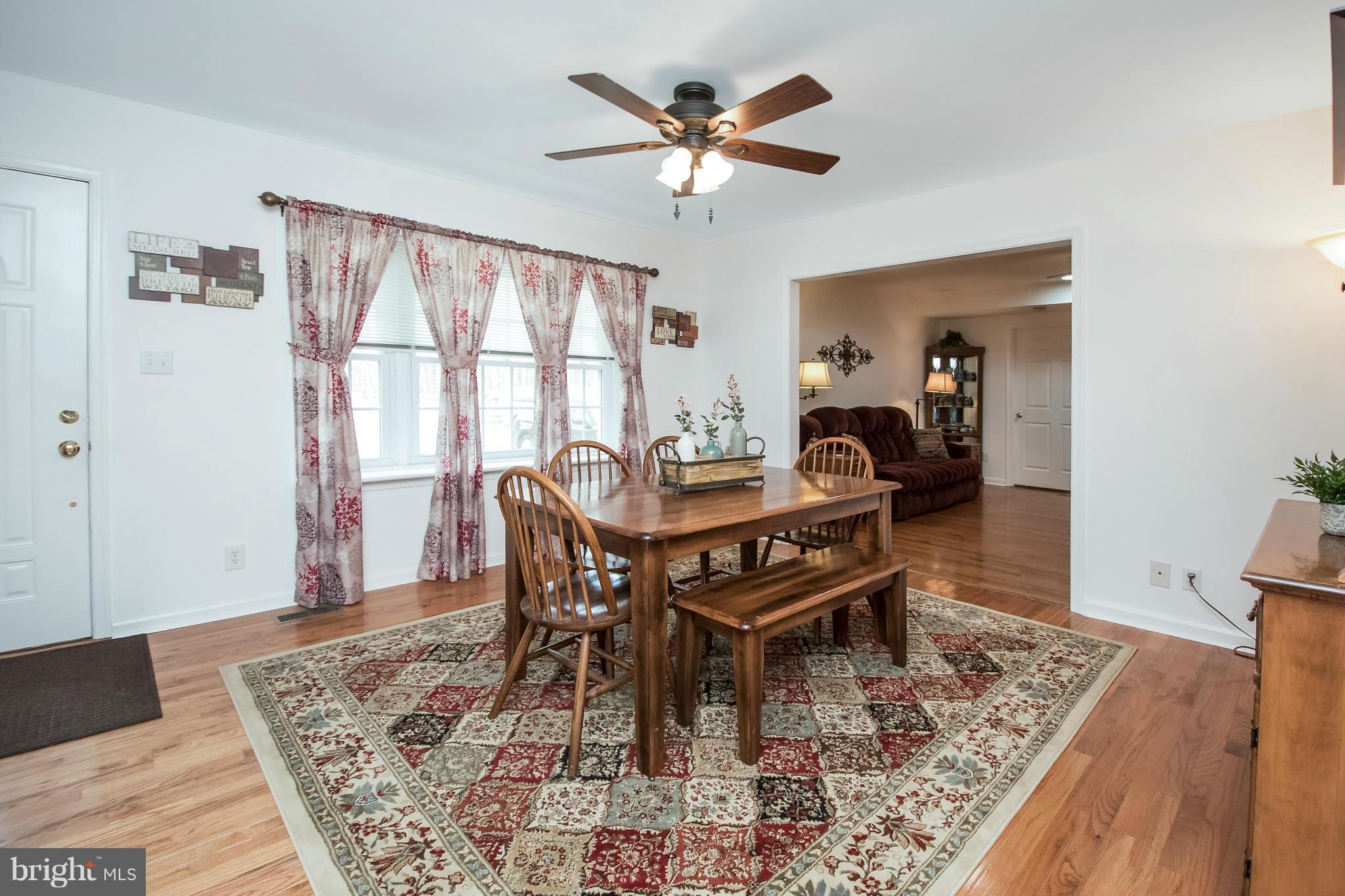 6101 Ridge Tree Road Fredericksburg, VA 22407 - Photo 10 of 30 a view of a dining room with furniture window and wooden floor